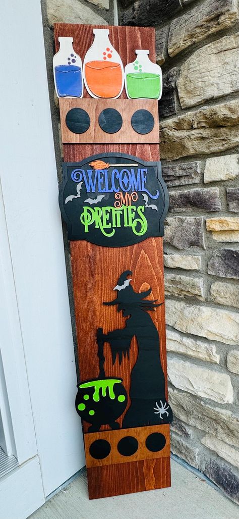 Introducing the new Halloween porch leaner post. These versatile decorations are perfect for displaying by your front door, enhancing seasonal front porch decor, hanging in a mudroom, or brightening up an entryway. Designed for outdoor use, they can also be used indoors, in a camper, or given as a thoughtful gift. Each post comes with a wire hanger on the back to secure it in place, especially if you choose not to hang it, preventing it from being blown over by the wind. The beautifully crafted Front Porch Witch Decorations, Halloween Door Leaner, Halloween Porch Boards, Halloween Welcome Signs Front Porches, Witches Faces, Door Leaner, Xtool F1, Halloween Welcome Sign, Porch Leaners