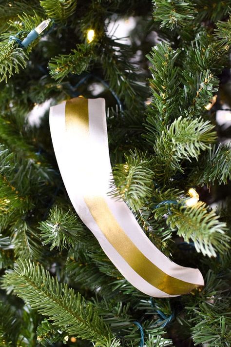 How to Put Ribbon on a Christmas Tree - Monica Wants It % Christmas Tree Topper Ribbon, Christmas Tree Ribbon Garland, Ribbon On A Christmas Tree, Christmas Tree Decorating Themes, Ribbon Garland, Black Christmas Trees, White Christmas Trees, Ribbon On Christmas Tree, Creative Activities For Kids