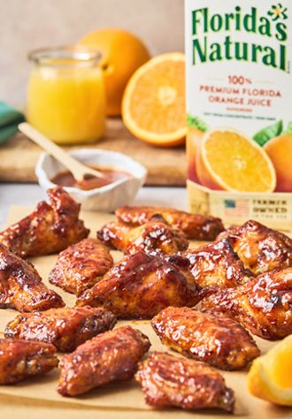 ORANGE HONEY BBQ WINGS Wings Cooked In Orange Juice, Orange Juice Wings, Cooking Chicken Wings In Orange Juice, Chicken Wings Cooked With Orange Juice, Chicken Wings In Orange Juice, Chicken Wings Cooked In Orange Juice, Honey Orange Glaze, Orange Juice Chicken Wings, Orange Pepper Wings