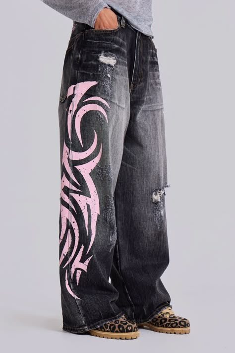 Pink Blade XL Colossus Jeans Original XL Colossus fit 5 pocket styling Heavy slub denim fabric Washed black colourway with sandblast Pink Tattoo screenprint down sides and back Distressed finish Model is 5 ft 9, size 8 and wears a size W30 for an oversized fit. Style code: JMJE490295% Cotton, 5% ViscoseMachine wash at 30 degreesCool iron on reverseLay flat to dryWash inside outRecommend washing on cold with similar colours Colossus Jeans, Custom Jeans Diy, Grey Pinstripe Suit, Pink Tattoo, Painted Clothes Diy, Making Clothes, Diy Clothes Design, Custom Jeans, Painted Jeans