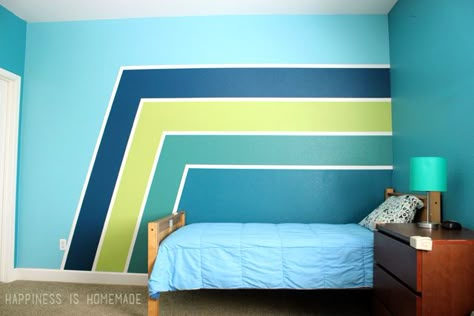 Make a HUGE impact in your bedroom with paint! These racing stripes took only minimal effort, and they completely update the look of the space! Use Frog Tape for perfect crisp and clean lines! Striped Accent Walls, Bedroom Paint Design, Boys Room Blue, Striped Bedroom, Boys Bedroom Paint, Green Accent Walls, Blue Accent Walls, Accent Wall Paint, Bedroom Wall Designs