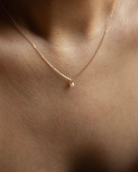 Mini Pearl Pendant Necklace This Mini Pearl Pendant Necklace is the perfect complement for your evening wear or casual wardrobe. Crafted from 14k gold, this delicate necklace features a small cultured pearl, lending it a minimalist and elegant look. With this classic and versatile accessory, you're sure to make a statement. Pearl size: 2.75-3mm 14k Yellow Gold PLE...#JewelryAddict #Jewelry #Gemstone #Accessories #JewelryLovers #Style #Fashion #StatementJewelry #HandmadeJewelry #JewelryDesign Pearl Necklace Simple, Simple Pearl Necklace, Dainty Pearl Necklace, Simple Pearl, Meaningful Jewelry, Necklace Simple, Jewelry Lookbook, Wedding Jewellery Necklace, Pearl Pendant Necklace