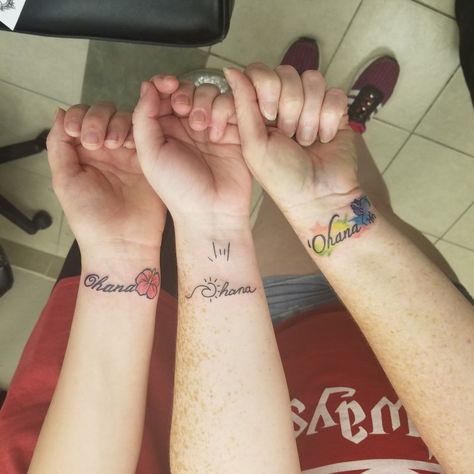 Ohana mother daughter tattoos. Older sister on the left with the hibiscus, middle child in the middle with the sun, wave, and ily sign, and mom on the right with the watercolor Stitch Mother Son Hawaiian Tattoo, Mother Daughter Stitch Tattoos, Stitch Sister Tattoos, Stitch Mother Daughter Tattoos, Mother 2 Daughter Tattoos Matching, Ohana Watercolor Tattoo, Mother Daughter Granddaughter Tattoos, Mother Daughter Disney Tattoos, Mom And 2 Daughter Tattoos