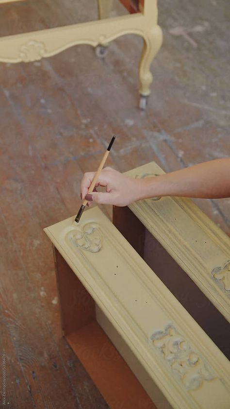 A young woman upcycling a vintage drawer. DIY painting and color change to fit into modern interior design. Brush strokes. Close-up hands shot. Drawer Diy, Vintage Drawer, Vintage Drawers, Modern Interior Design, Young Woman, Diy Painting, Brush Strokes, Modern Interior, Color Change