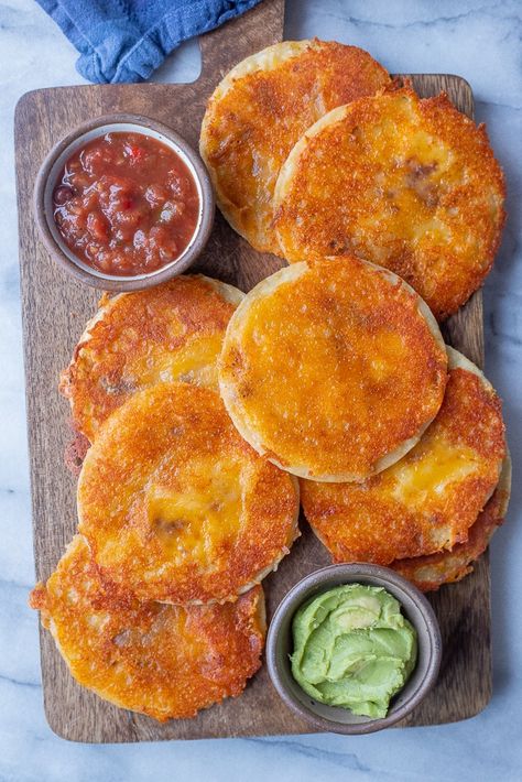 These delicious Cheese Crisps only have 3 ingredients and are so easy to make! They can be enjoyed as an appetizer, snack or even a main course with a couple of added side dishes! I also like to stuff them with my favorite taco fillings and use it as a taco shell. You only need tortillas, cheese and taco seasoning to make them! #cheesecrisp #3ingredientrecipe #vegetarianfood #kidfriendly #easysnack Corn Tortilla Snacks, Tortilla Cheese Crisps Baked, Tortilla Chip Mini Tacos, Crispy Tortilla Shells, Mini Corn Tortillas Recipes, Cojita Cheese Uses, Tortilla Cheese, Corn Tortillas Tacos, Dominos Game