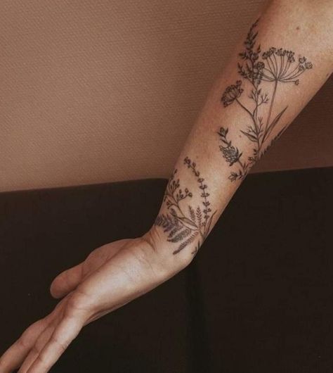 Arm Tattoos For Women Wild Flowers, Flower Forearm Tattoo Wrap Around, Wild Flowers Arm Tattoo, Plant Tattoo Around Wrist, Floral And Greenery Tattoo, Daucus Carota Tattoo, Wrap Around Forearm Tattoo Women Flowers, Greenery Half Sleeve Tattoo, Flower Tattoo Forearm Men