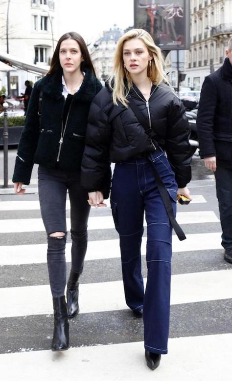 Nicola Peltz wearing a black cropped puffer jacket, white square neck cropped t-shirt, wide-leg cargo jeans, black platform ankle booties, and a black bum bag Cargo Jeans Black, Nicola Peltz, Nicolas Peltz, Cropped Puffer Jacket, Fall Fits, White Square, Coat Outfits, Black Platform, Cropped T Shirt