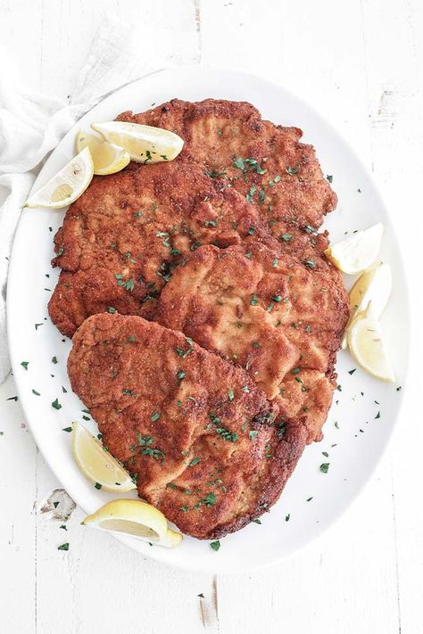 This classic Pork Schnitzel recipe is coated in breadcrumbs and pan-fried until golden brown and served with lemon for the perfect weeknight meal. Chicken Schnitzel Recipe, Pork Schnitzel Recipe, Schnitzel Recipe, Chicken Cutlet Recipes, Schnitzel Recipes, Boiled Chicken Breast, Pork Schnitzel, Chicken Schnitzel, Broiled Chicken