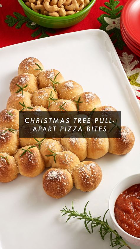 O Christmas tree, how lovely are your… pepperonis? Sleigh the holiday season with these delicious Christmas Tree Pull-Apart Pizza Bites. Enjoy an easy pull-apart bread recipe with mozzarella and pepperoni stuffed inside pizza crust dough and served with seasoned tomato sauce for dipping. Share this cozy comfort dish with friends and family to really spruce the holiday party up. Click the link to view the full holiday recipe. #appetizers #holidayrecipes Pull Apart Pizza Bites, Recipe With Mozzarella, Pull Apart Pizza, Pizza Crust Dough, Bread Pull Apart Recipes, Ready Set Eat, Pizza Bites, Holiday Appetizers, Christmas Party Food