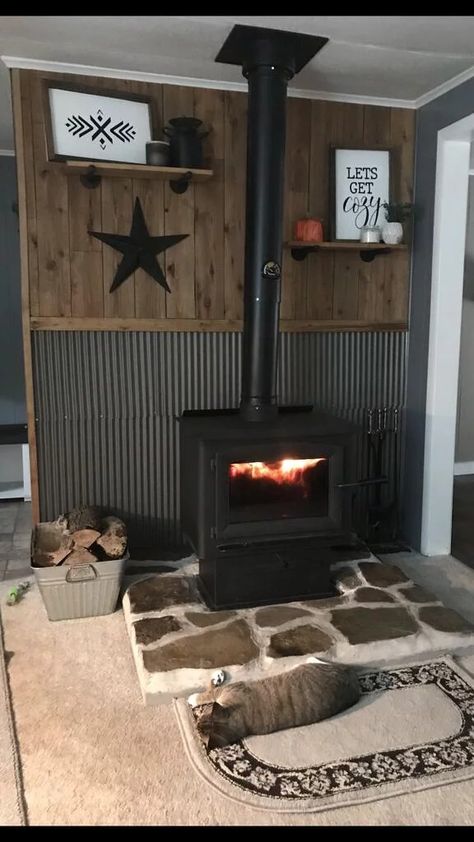 Tin Walls Rustic Living Room, Wood Stove In Garage, Tin Home Decor, Wood Stove Platform Ideas, Tin Behind Wood Stove, Wood Stove Tile Surround, Wood Stove Surround Ideas, Wood Stove Backsplash, Wood Stove Mantle