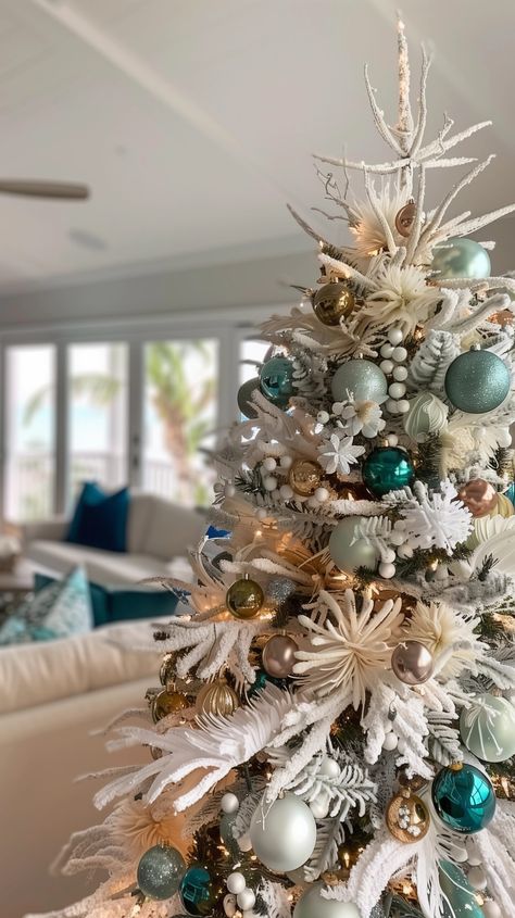 12 Stunning Christmas tree Themes {2024} - House On Austin Aqua Blue Christmas Tree, Aqua Christmas Tree Decor, Tropical Christmas Tree Ideas, Beachy Christmas Tree Ideas, Tiffany Christmas Tree, Turquoise Christmas Tree Ideas, Teal Christmas Tree Ideas, Teal And Red Christmas Decor, Beach Theme Christmas Tree Ideas