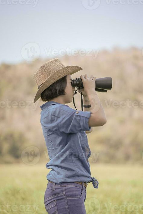 Woman wear hat and hold binocular in grass field Person With Binoculars, Inktober 2024, Grass Field, Infographic Design, Binoculars, Free Stock Photos, Hold On, Royalty Free Stock Photos, Women Wear