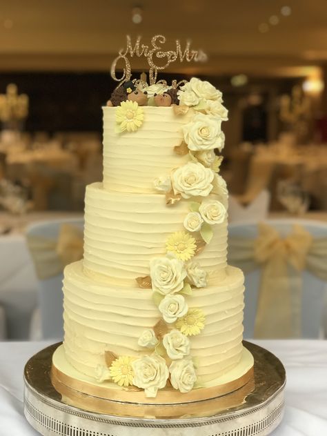 Wedding Cake. Buttercream covered with sugar flowers and hedgehog topper. Bottom tier chocolate sponge with white chocolate buttercream, middle tier sticky ginger sponge with ginger buttercream and butterscotch sauce, topped with red velvet cake with a fresh cream cheese filling. Acrylic name topper Ginger Buttercream, Wedding Cake Buttercream, Wedding Cake Simple Elegant, Wedding Cake Simple, Yellow Wedding Cake, Cream Wedding Cakes, Butterscotch Cake, White Chocolate Buttercream, Tier Cakes