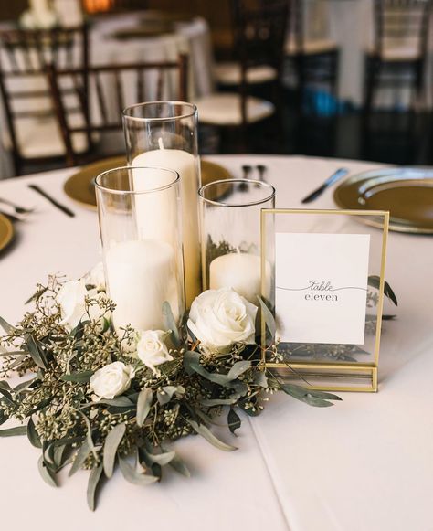 Gold And Eucalyptus Centerpiece, Simple Classy Centerpieces Wedding, Mums Flowers Wedding Decor, Classy Table Decor Wedding, White Flowers And Greenery Centerpieces, White Greenery Centerpieces, Round Wedding Table Decorations Greenery, Champagne And Greenery Wedding Decor, Simple Neutral Wedding Centerpieces