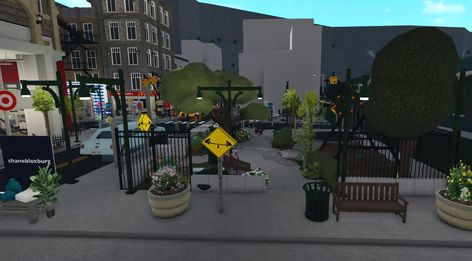 Bloxburg City Entrance, Bloxburg Town Ideas List, Flower Shop Bloxburg, Bloxburg Park, Bloxburg City Ideas, Bloxburg Town Layout Small Plot, Bloxburg Nyc, City Bloxburg, Simple House Exterior