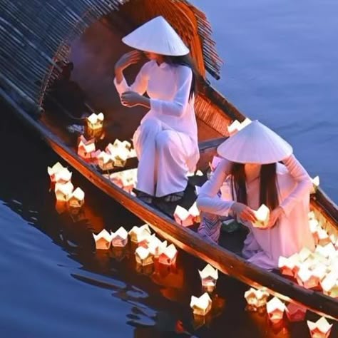 Daniel Kordan on Instagram: "On the tranquil waters of Hue’s Hong River in Vietnam, young women don traditional garb to perform the sacred Candle Flower ritual. This age-old tradition, observed during major holidays and festivals, honors Vietnam’s spiritual values and culture. Each lit flower-shaped lamp represents a prayer for health and peace, creating a captivating spectacle that beautifully embodies the essence of Vietnam’s heritage. Filmed in low light with @nikoneurope Z8 + 50 mm f/1.8 Nik Vietnamese Culture, Vietnam Culture, Vietnamese Aesthetic, Vietnamese Culture Aesthetic, Vietnam Aesthetic, Vietnam Lantern Festival, Hoi An Lantern Festival, Vietnam Lotus, Floating Lantern Festival Thailand