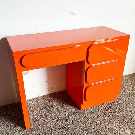 Add a vibrant splash of color to your workspace with this Postmodern Orange Lacquer Writing Desk. Featuring a striking orange laminate… | Instagram Postmodernism Interior Design, Funky Rooms, Rooms Desk, Postmodern Furniture, Funky Desks, Pink Office Decor, Cool Desk, Vintage Leather Chairs, Computer Writing