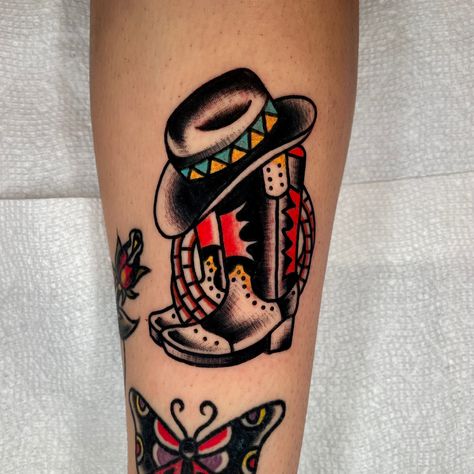 Cowboy Hat American Traditional Tattoo, Old Western Traditional Tattoo, Traditional Boot Tattoo, Southwest Traditional Tattoo, Western Themed American Traditional Tattoos, Traditional Cowboy Boots Tattoo, Old School Tattoo Cowboy, American Traditional Cowboy Boot Tattoo, Tattoos Western Style