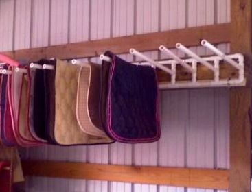 This PVC Saddle Pad Wall Rack would be a great idea for in the garage for other items. Horse Blanket Storage, Horse Blankets Storage, Blanket Storage Ideas, Tack Storage, Horse Hacks, Tack Room Organization, Horse Tack Rooms, Saddle Racks, Horse Farm Ideas