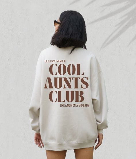 Celebrate Your Cool Aunt with Our Chic Cool Aunts Club Sweatshirt! 🎁 The Perfect Gift for Your Beloved Aunt! Introducing our stylish Cool Aunts Club sweatshirt, an ideal present for birthdays, Mother's Day, or Christmas! WHY YOU'LL LOVE OUR SWEATSHIRT: - Trendy Design: Elevate your aunt's style with our chic Cool Aunts Club sweatshirt. - Versatile Gift: Perfect for any special occasion, from birthdays to Christmas. - Premium Quality: Crafted from ultra-soft, high-quality materials for ultimate comfort. **HOW TO ORDER 1. Browse Options: Explore our delightful selection of colors and sizes. 2. Choose Quantity: Add as many sweatshirts as you like--your choice! 3. Select Size & Color: Use our easy drop-down menus. 4. Quick Checkout: Click "ADD TO CART" for a seamless shopping experience. 🚀 F Auntie Sweater, Auntie And Niece, Mothers Birthday Gift, Gifts For Auntie, Cool Aunt Club, Auntie Sweatshirt, Promoted To Aunt, Gifts For Aunts, Auntie Life