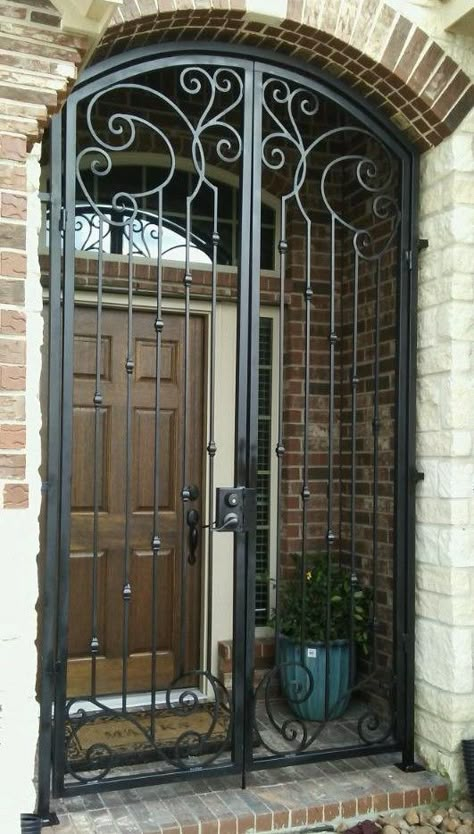 Gated Front Door Entryway, Wrought Iron Gates Entrance Front Entry, Iron Gate Designs Front Entry, Metal Security Door, Modern Entrance Design, Front Door Security, Wrought Iron Front Door, Spanish Style Decor, Beautiful French Doors