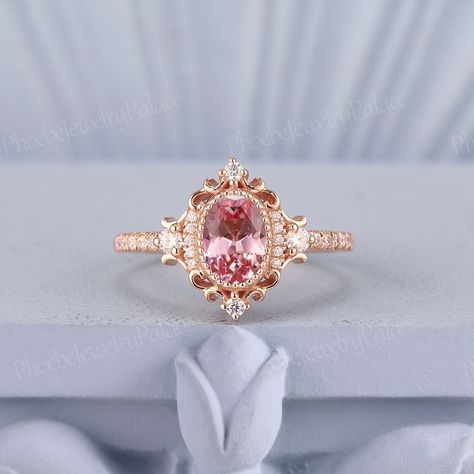 Vintage Peach Pink Sapphire Engagement Ring Oval Wedding Rings for Women Solid Gold Diamond Cluster Cocktail Ring Anniversary Handmade Gift PRODUCT SUMMARY Metal Type: yellow, white or rose solid 10k, 14k or 18k gold. Size: All sizes are available, contact me if they do not contain the size you want in the drop-down menu. ☪☪Engagement ring ⚜Center Stone - Lab Grown Peach Pink Sapphire Cut - Oval Size - 5x7mm ⚜Side Stone - Moissanite or Natural Diamond Cut - Round Weight - 0.21ct Clarity - SI-VS Pink Engagement Ring Vintage, Oval Wedding Rings, Pink Wedding Ring, Sapphire Engagement Ring Oval, Peach Sapphire Rings, Pink Sapphire Engagement Ring, Oval Sapphire Engagement Ring, Pink Diamonds Engagement, Pink Wedding Rings