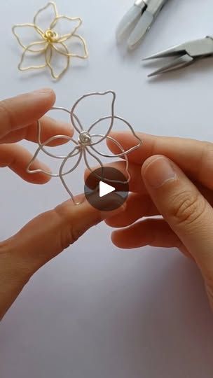 1.6K reactions · 276 shares | Making a flower 🌸

This flower is so fun to make 😊

Get them as earrings on my Etsy! Link in bio 💞

Tags~ #flower #jewellery #etsy #smallbusinesssupport #artistofinstagram #etsyseller | Mari Diy Wire Flower Earrings, Wire Flower Template, Making A Flower, Wig Jig, Wire Ornaments, Wire Wrapping Tutorial, Plant Stakes, Beaded Art, Wire Flowers