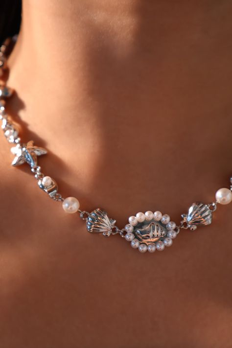 Flicker goodbye to dullness and stand out in our Platinum Plated Mermaid Sea Shell Necklace. With the proper lighting, the shell pearls add a pop of shine to your ensemble. This unique necklace makes your outfit stand out and is also a great gift for her or him. 
 - High-quality platinum plated + well-cut zirconia moonstones + shell pearls 
 - With an extra layer of protection for extra strength and luster. Made to last 
 - Water-resistant and hypoallergenic 
 Length: 22.3 in. with two 4.1 in... Sea Shell Necklace, Contemporary Dresses, Seashell Necklace, Shortening, Shell Necklace, Unique Necklace, Shell Necklaces, Moon Stone, Unique Necklaces