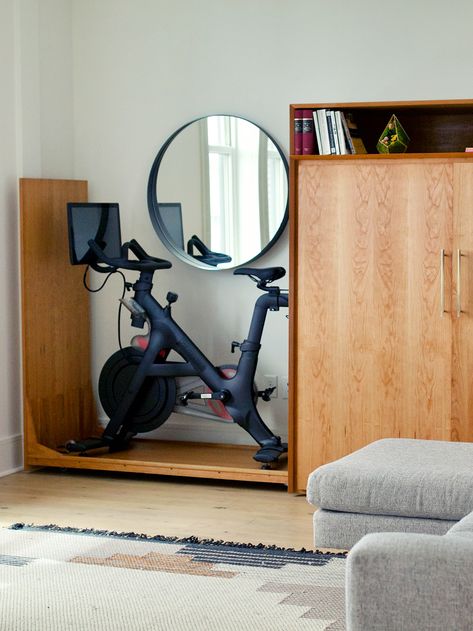 Guest Room Peloton, Peloton And Office Room, Living Room With Peloton, Bedroom With Exercise Equipment, Peloton In Small Apartment, Bedroom With Gym Equipment, Exercise Equipment Storage Small Spaces, Hide Peloton Bike, Hidden Gym Equipment Storage