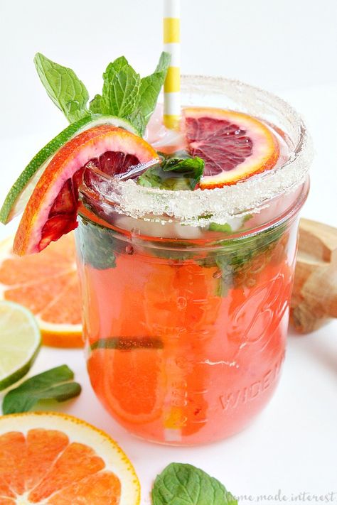 Blood oranges and a little mint make this Blood Orange Mojito beautiful and delicious. I’ll be enjoying this easy mojito recipe all summer long. Titos Vodka Recipes, Mojito Recipe Pitcher, Orange Mojito, Lime Garnish, Easy Mojito Recipe, Mexican Cocktails, National Watermelon Day, Traditional Margarita, Watermelon Day