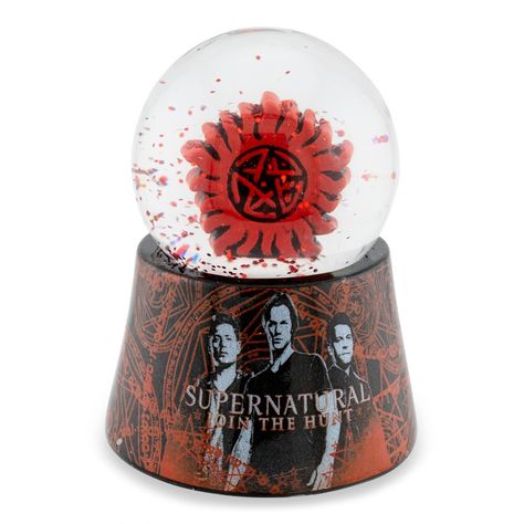 Shake up your fandom with this collectible Supernatural snow globe! Featuring the Anit-Possession Symboln, this fun snow glove measures approximately 2.75-inches tall - the perfect size for your office desk, home bookshelf and so much more! Officially licensed snow globe. Produced by Silver Buffalo, a trendsetting housewares and home decor company based in the heart of New York City. A Toynk exclusive! Supernatural Accessories, Supernatural Merch, Supernatural Anti Possession, Goth Apartment, Anti Possession Symbol, Home Bookshelf, Supernatural Merchandise, Office Desk Home, Home Bookshelves