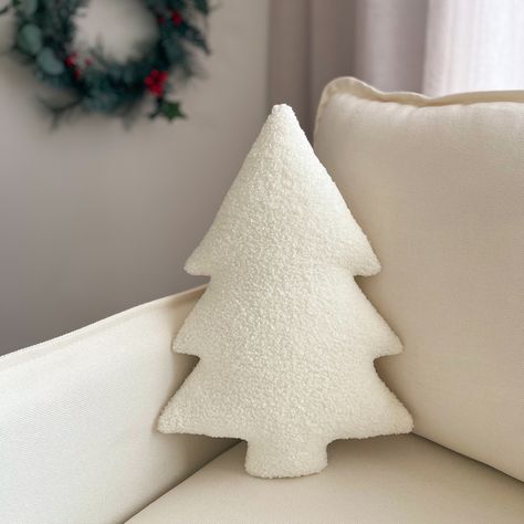 Christmas tree decorative cushions handmade from a soft Teddy fleece fabric. These super soft and plush pillows are available in 2 different sizes; Small 30cm x 22cm Large 40cm x 30cm Mix and match alternating colours and sizes to add an extra touch to your decor.  Our Christmas tree pillows are the perfect textured plush accessory for your Christmas decor or make the perfect gift for someone special.  Cleaning: It is recommended that you use a wet cloth and warm soapy water to spot-clean the ma Modern Christmas Pillows, Christmas Decor Pillows, White Christmas Pillows, Winter White Christmas Decor, Cream Christmas Pillows, Beige Christmas Aesthetic, Christmas Tree Cushions, Xmas Tree Pillow, Christmas Tree Shaped Cushion