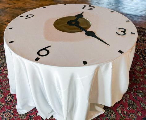 DIY clock party theme decorations: Turn a table into a clock using black and gold paper. Make this DIY clock decor for a school fundraiser, wedding, retirement party, or milestone birthday! #clock #party #theme #decor #DIY #retirement #fundraiser #ideas #wedding #birthday Diy Gold Table Decor, Clock Wedding Theme, Clock Table Decorations, Time Theme Decor, Time Travel Birthday Party, Back In Time Party Theme, Time Travel Party Theme, Clock Theme Party Decoration, Clock Party Decorations