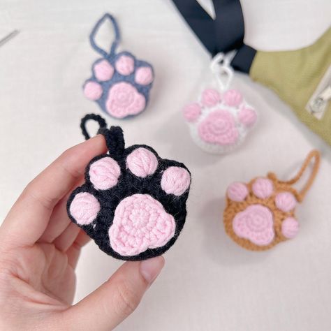 It’s been a while since I last uploaded anything due to personal reasons, but I’m back now with a new tutorial! 😁🥰 What do you guys think of this low-sew Cat Paw Bag Charm? 🐈 🐾 Check out my latest video on Monua DIY on YouTube! I’m sure it will take less than 20 minutes to create your own bag charm or keychain. Have fun crafting! (^_−)−☆ #crochet #tutorial #crocheting #bag #bagcharm #cat #catsofinstagram #catlover #catpaw #accessories #cute #diy #beginner #freepattern #crochetpattern #free... Crochet Bag Keychain, Cat Paw Crochet, Crochet Charm Bag, Crochet Paw Keychain Pattern Free, Bag Charm Crochet Pattern, Crochet Paw Keychain, Cat Keychain Crochet Free Pattern, Cute Crochet Bag Charms, Crochet Bag Charm