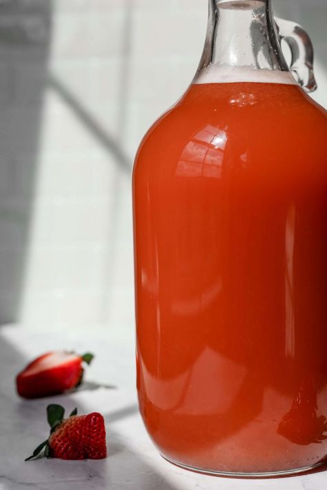 This hard strawberry cider recipe makes a delicious home-brewed fruit cider, perfect for spring and summer. You can bottle strawberry hard cider with honey for a refreshing sparkling cider. Orange Cider Recipe, Strawberry Cider, Hard Cider Recipe, Cheap Vodka, Cider Making, Sparkling Cider, Cider Recipe, Strawberry Syrup, Hard Cider