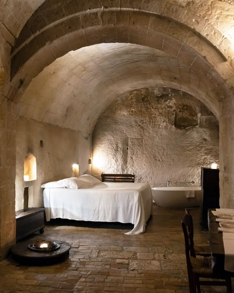 Discover the most luxurious cave hotel in Matera: the Sextantio "Le Grotte della Civita", a scattered hotel located in the city's Sassi. Converted Church, Doomsday Bunker, Unusual Hotels, Cave Hotel, Winter Mountains, Italian House, Cave Home, Cave House, Medieval Life