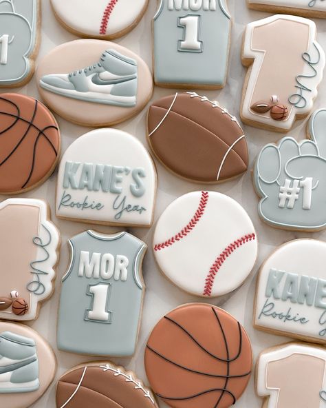 Happy Rookie Year Kane 🏀🏈⚾️ #cookies #njcookies #cookiesofinstagram #decoratedsugarcookies #firstbirthdaycookies #rookieyearbirthday | Instagram Born 2 Ball Cookies, Rookie Year First Birthday Cookies, Baseball Birthday Cookies, Rookie Of The Year Cookies, Sports Birthday Cookies, Rookie Year Cookies Baseball, Baseball Cookies Decorated 1st Birthday, Sports Cookies, Shower Pics