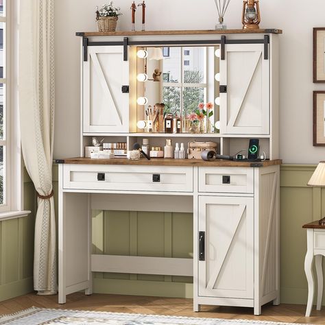 PRICES MAY VARY. [Farmhouse Style] This vanity desk stands out because of its rich farmhouse style. With a perfect blend of distressed white finishes, z-brace barn door trim, and exposed metal hardware, the makeup vanity desk is not only robust and sturdy, but it also has farmhouse charm and adds a relaxed, earthy aesthetic to the room. The unique sliding door design on the upper part can be used to hide the shelves/lighted mirror, both exquisite and practical [Powerful Storage Space] Overall si Vanity With Lights, White Vanity Table, White Vanity Desk, Vanity Desk With Mirror, Makeup Vanity Lighting, Desk With Mirror, Farmhouse Vanity, Sliding Door Design, Mirrored Vanity Desk