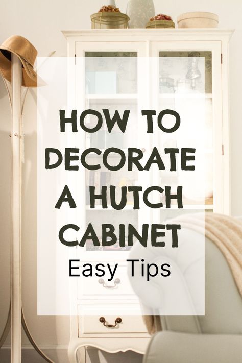 Say goodbye to boring hutches! Discover how to decorate a hutch in the living room with my easy-to-follow tips and tricks. You'll be amazed at how a simple storage hutch cabinet can become a stunning focal point in your home. A hutch not only provides valuable storage but also serves as a fantastic canvas for showcasing your personality and style. Decorate A Curio Cabinet, Styling A Cabinet With Glass Doors, Hutch Ideas Decorating, Decorate Glass Cabinets Living Room, How To Decorate Curio Cabinet, China Cabinet Decorating Ideas Display, Top Of Hutch Decor Ideas, How To Display China In Cabinet, Decorating A China Cabinet