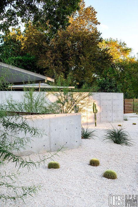 OES | Street view of concrete walls, crushed limestone xeriscape with succulents and native plants White Gravel Backyard, Crushed Limestone Landscaping, Desert Plants In Pots, Denmark Landscape, Desert Landscaping Backyard, Flipping Homes, Open Envelope, Dry Gardens, Crushed Limestone