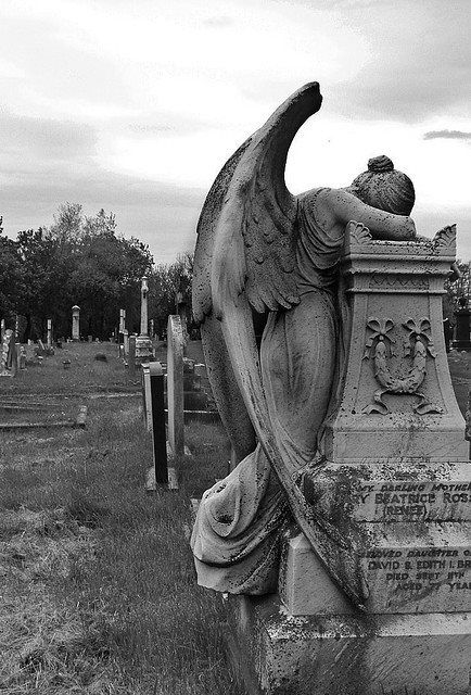 The "Weeping Angel" is very powerful.                                                                                                                                                     More Grave Art, Weeping Angels, Cemetery Angels, Cemetery Monuments, Cemetery Statues, Fantasy Angel, Cemetery Headstones, Grave Stones, Weeping Angel