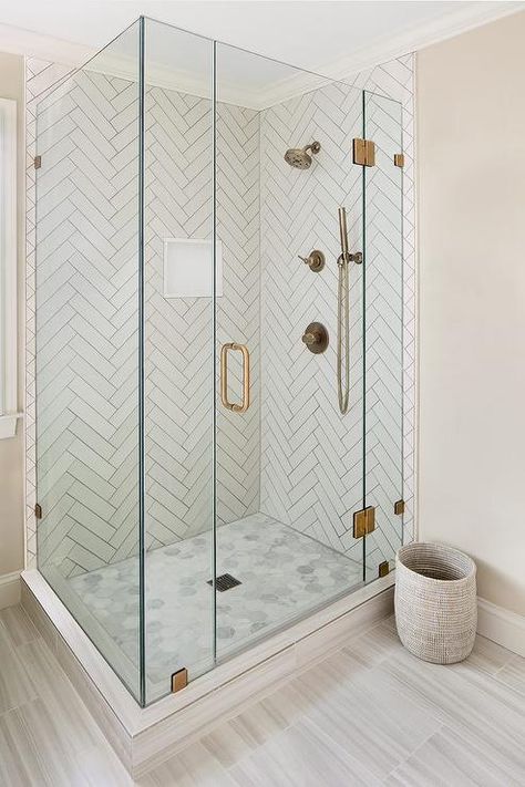 Master bathroom shower with white herringbone tiles and gray grout features perfect dimensional patterns. Herringbone Tile Shower Wall, Herringbone Shower, Patterned Bathroom Tiles, Shower Niche, Bathroom Shower Tile, Bathroom Remodel Designs, Trendy Bathroom, Corner Shower, Bathroom Floor Tiles