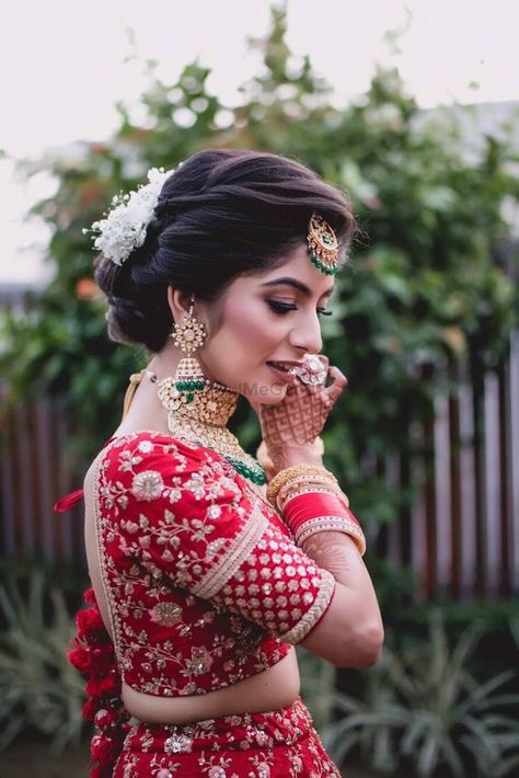 Photo of Bridal shot wearing jewellery in red lehenga Bride Lengha, Bride Swag, Shaadi Photography, Bride Fashion Photography, Bridal Hairstyle Indian Wedding, Indian Bride Makeup, Bridal Hairdo, Indian Bridal Photos, Bridal Hair Buns