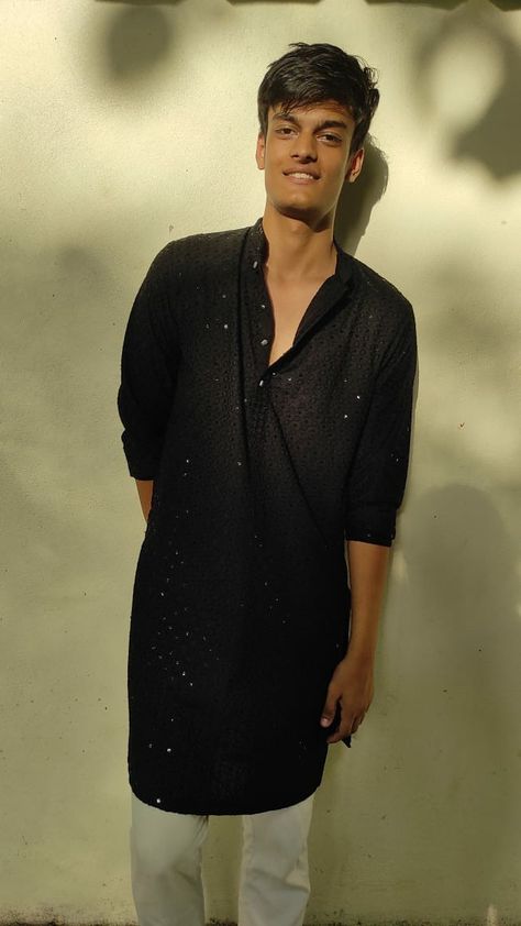 Man leaning against a wall,black kurta,in desi traditional attire, South asian clothes men indian boy Black Kurta Men Aesthetic, Black Kurta For Boys, Men In Kurta Aesthetic, Desi Boy Aesthetic Kurta, Aesthetic Kurtas For Men, Black Kurta Aesthetic, Black Kurta Men, Kurta Aesthetic, Aesthetic Culture