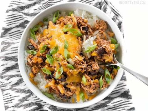 Slow Cooker Taco Chicken Bowls are the ultimate "set it and forget it" easy weeknight meal that the whole family will love. BudgetBytes.com Slow Cooker Taco Chicken, Slow Cooker Taco, Slow Cooker Chicken Fajitas, Chicken Taco Bowls, Taco Chicken, Chicken Cooker, Slow Cooker Chicken Tacos, Slow Cooker Bbq Chicken, Chicken Bowls