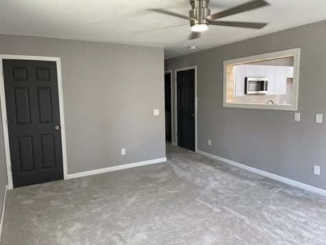 Gray Walls Gray Doors, Dark Doors With White Trim Grey Walls, Black Interior Doors With Gray Walls, Gray Interior Trim And Doors, Grey Room Black Trim, Grey Walls And Black Doors, Light Grey Walls With Black Trim, Dark Interior Doors With White Trim, Dark Grey Doors Interior