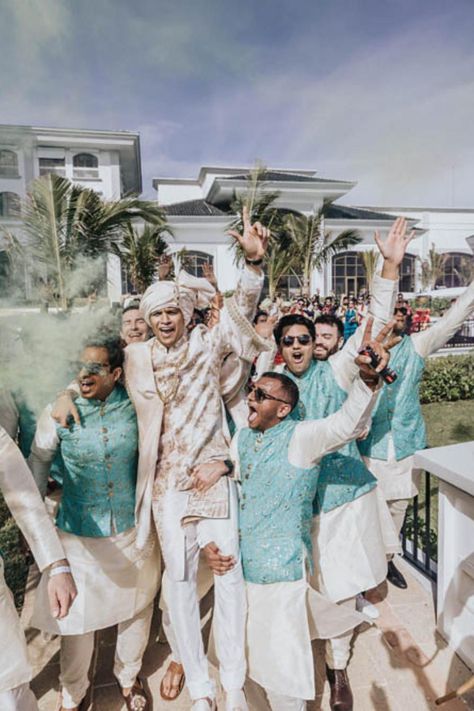 During the baraat, or wedding procession, the groom's friends and family celebrate by dancing and enjoying the festivities. This joyous moment is captured as a groomsman enjoys the celebration. | JW MARRIOTT RESORT CANCUN WEDDING | Video : Derek Chan | Wedding Film | Indian Wedding Photography | Wedding Vibe | Baraat Celebration | Groom Friends Photography, Indian Wedding Bridal Party, Group Of Men Aesthetic, Groomsmen Indian Outfits, Indian Wedding Family Photos, Groomsmen Indian, Indian Groomsmen Outfits, Sangeet Photography, Indian Groomsmen