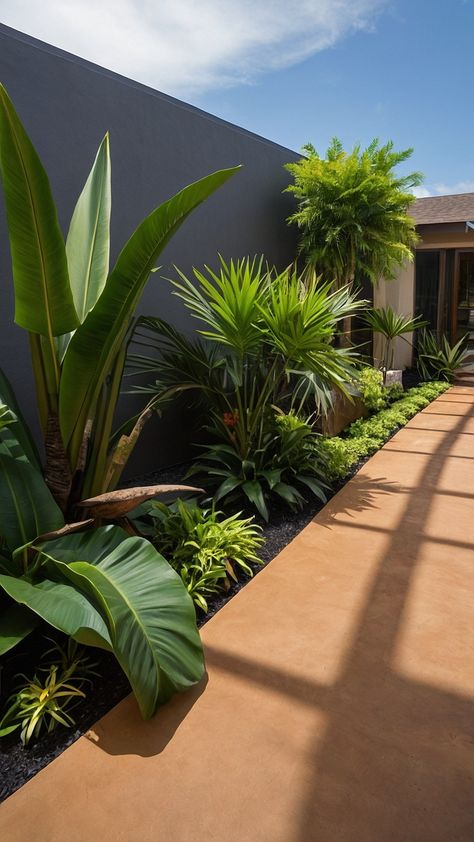 Transform your outdoor space with stunning tropical landscape design ideas for your modern garden Explore Balinese garden plans backyard ideas front yard entrance styles and lush backyard designs From small to full sun areas discover minimalist and luxurious inspirations for your outdoor oasis Modern Boho Front Yard Landscaping, Palm Tree Landscape Ideas Backyards, Modern Florida Landscaping, California Backyard Ideas, Front Yard Entrance, Yard Entrance, Lush Backyard, Balinese Garden, Palm Trees Landscaping