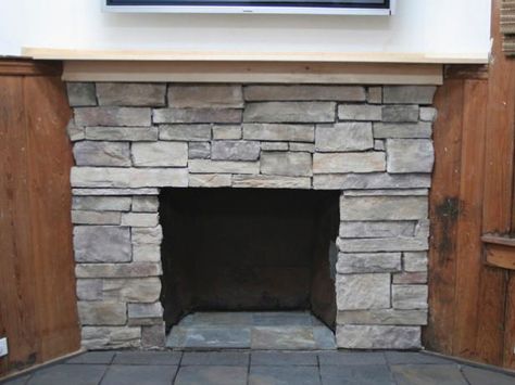 HGTV shows you how to resurface an old brick fireplace with stone and slate. --> http://www.hgtv.com/design/decorating/design-101/how-to-cover-a-brick-fireplace-with-stone?soc=pinterest Cover A Brick Fireplace, Update Brick Fireplace, Fireplace With Stone, Faux Stone Fireplaces, Brick Fireplace Wall, Stone Veneer Fireplace, Red Brick Fireplaces, Painted Brick Fireplaces, Faux Stone Panels