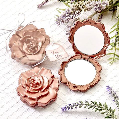 PRICES MAY VARY. Travel Makeup Mirror: Our beautiful rose design compacts feature a case made of hard molded plastic, finished in a dusty rose color. The cover's two dimensional molded 'petals' bring the beautiful rose blossom design to life. Cosmetic Mirror: The compact mirror opens with a side hinge to reveal a dual sided glass mirror inside and is ideal for makeup applications. Party Favor: This exquisite favor is presented in a clear display box with a white string elastic wrap and bow. Atta Party Favor Wedding, Sweet 16 Favors, Quinceanera Favors, Rose Mirror, Clear Gift Boxes, Travel Makeup Mirror, Bridal Shower Party Favors, Design Mirror, Rose Blossom